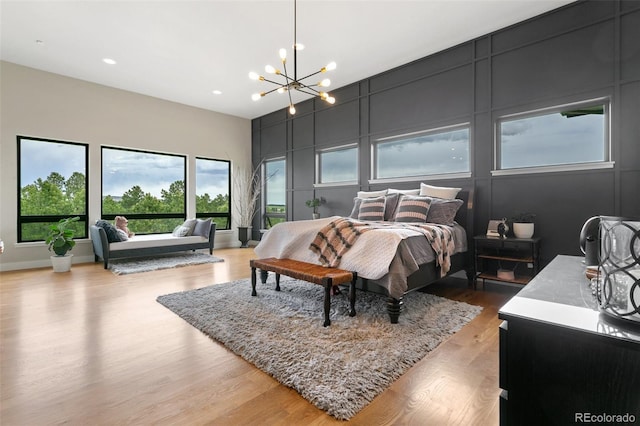 843 Long Timber Ln, Monument, CO 80132 - bedroom featuring a chandelier, light wood-type flooring, and recessed lighting