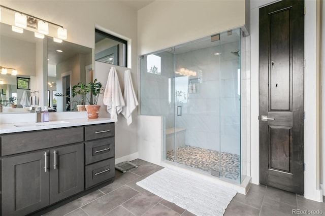 843 Long Timber Ln, Monument, CO 80132 - bathroom featuring vanity, tile patterned flooring, a shower stall, and plenty of natural light