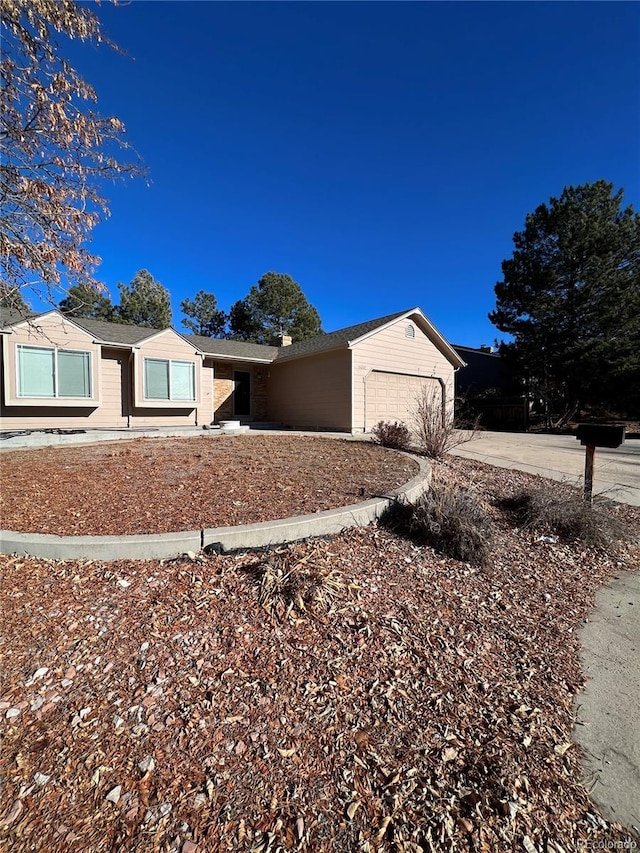 ranch-style home with a garage