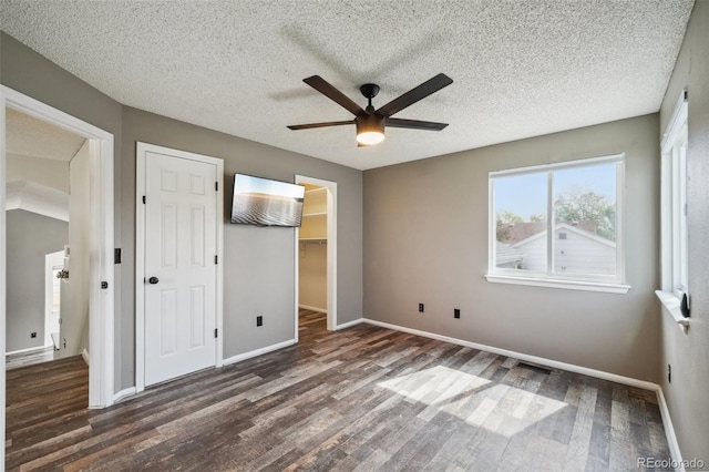 68 N Quicksilver Ave, Castle Rock, CO 80104 - unfurnished bedroom featuring wood finished floors, baseboards, a textured ceiling, a closet, and ceiling fan