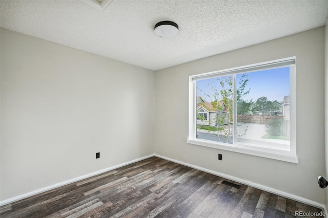 68 N Quicksilver Ave, Castle Rock, CO 80104 - spare room with dark wood-style flooring, baseboards, and a textured ceiling