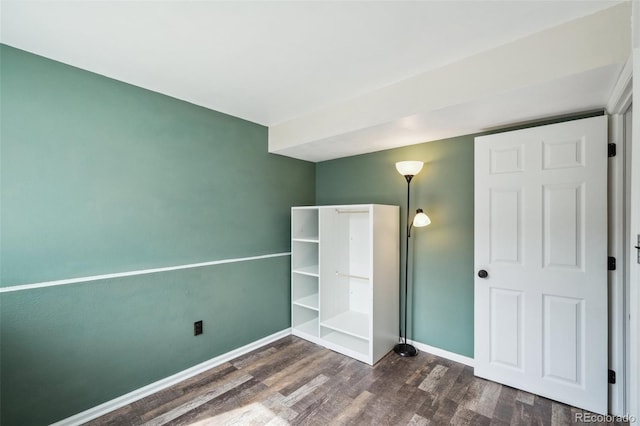 68 N Quicksilver Ave, Castle Rock, CO 80104 - unfurnished bedroom with dark wood-type flooring and baseboards