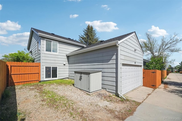 68 N Quicksilver Ave, Castle Rock, CO 80104 - rear view of house featuring fence and a detached garage