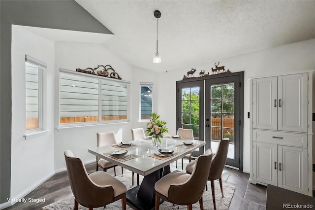 68 N Quicksilver Ave, Castle Rock, CO 80104 - dining space featuring a textured ceiling, baseboards, and vaulted ceiling