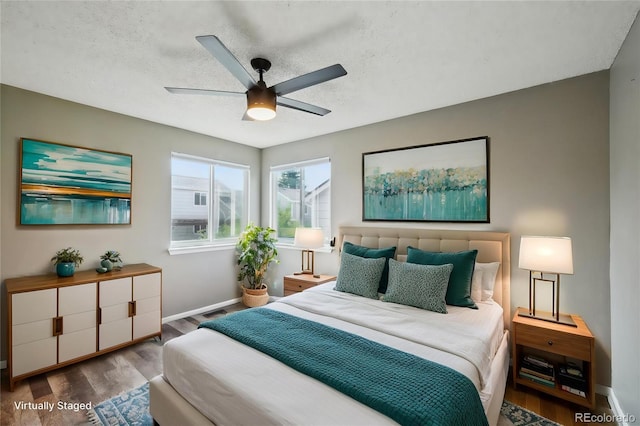 68 N Quicksilver Ave, Castle Rock, CO 80104 - bedroom featuring baseboards, wood finished floors, a textured ceiling, and a ceiling fan