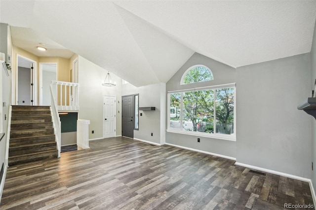 68 N Quicksilver Ave, Castle Rock, CO 80104 - unfurnished living room featuring wood finished floors, baseboards, stairs, and lofted ceiling