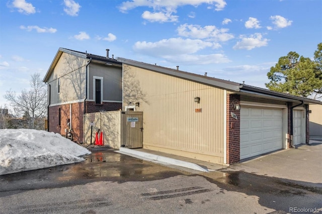 view of property exterior featuring brick siding