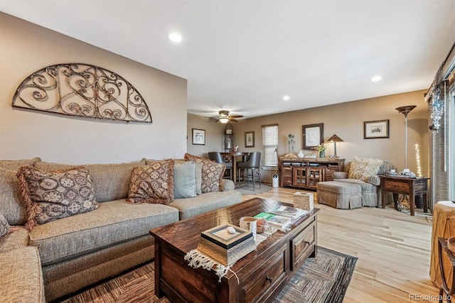 living room with recessed lighting, ceiling fan, and light wood finished floors