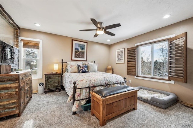 bedroom with ceiling fan, light colored carpet, recessed lighting, visible vents, and baseboards