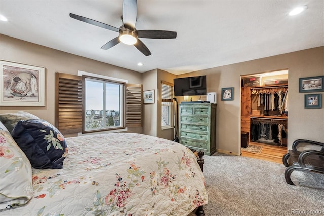 carpeted bedroom with ceiling fan, recessed lighting, baseboards, a spacious closet, and a closet