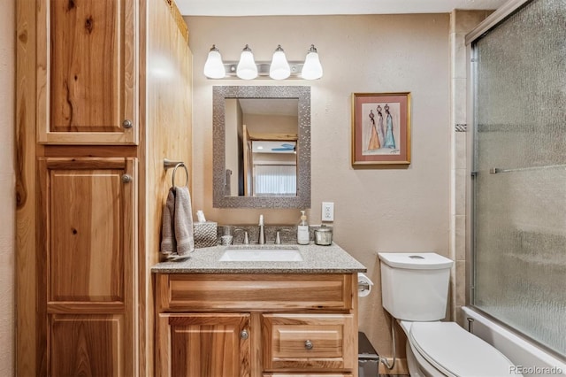 full bathroom featuring vanity and toilet