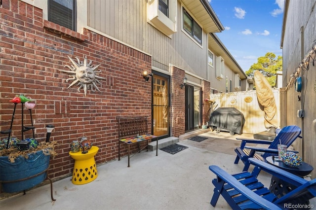 view of patio featuring fence and grilling area