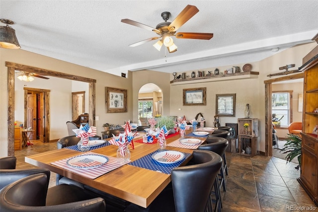 50 Rd P78, Bailey, CO 80421 - dining area with ceiling fan, arched walkways, a textured ceiling, and stone tile flooring