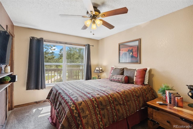 50 Rd P78, Bailey, CO 80421 - bedroom with carpet floors, baseboards, a textured ceiling, and a ceiling fan