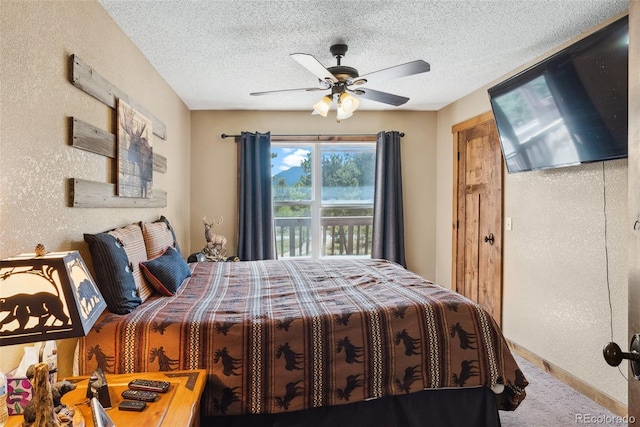 50 Rd P78, Bailey, CO 80421 - carpeted bedroom with a textured ceiling, a textured wall, and ceiling fan