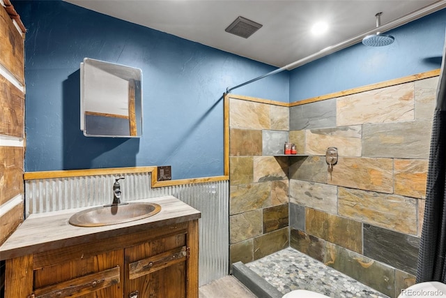 50 Rd P78, Bailey, CO 80421 - full bathroom with a tile shower, vanity, and a wainscoted wall