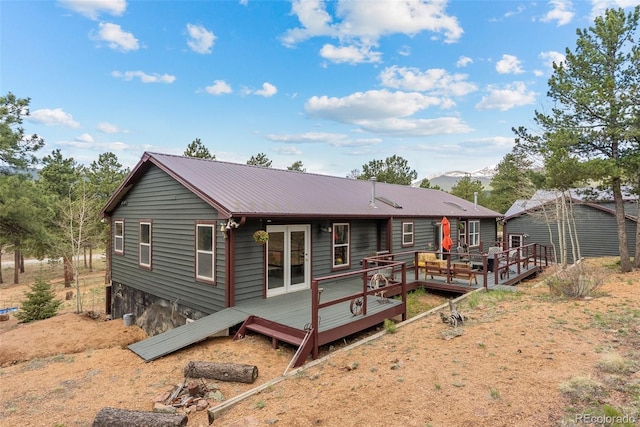 50 Rd P78, Bailey, CO 80421 - rear view of house featuring a wooden deck and metal roof