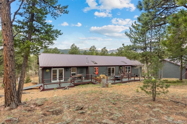 50 Rd P78, Bailey, CO 80421 - view of front of house with a deck with mountain view and metal roof