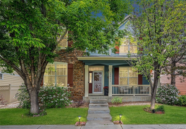 12951 Vallejo Cir, Denver, CO 80234 - view of front of home featuring a porch and stone siding