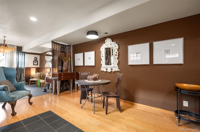 469 Elati St, Denver, CO 80204 - dining space featuring baseboards, wood finished floors, and visible vents