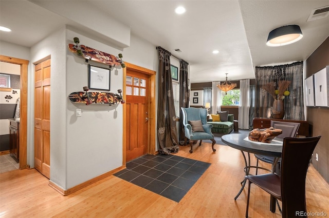 469 Elati St, Denver, CO 80204 - foyer with baseboards, recessed lighting, wood finished floors, and visible vents