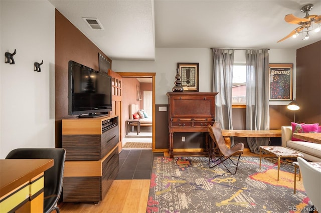 469 Elati St, Denver, CO 80204 - sitting room with a ceiling fan, visible vents, and wood finished floors