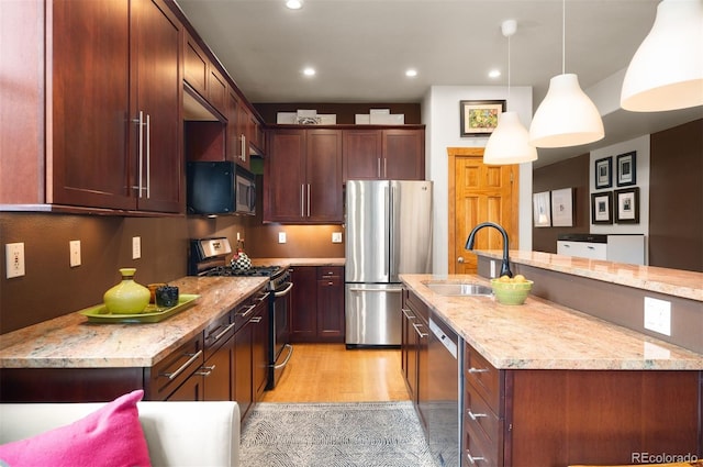469 Elati St, Denver, CO 80204 - kitchen with recessed lighting, a sink, decorative light fixtures, and stainless steel appliances