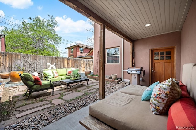 469 Elati St, Denver, CO 80204 - view of patio featuring a fenced backyard, a grill, and outdoor lounge area