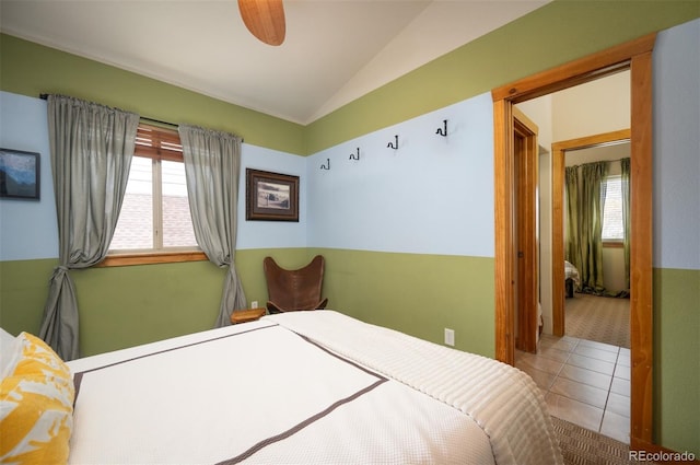 469 Elati St, Denver, CO 80204 - bedroom with tile patterned flooring, carpet floors, and vaulted ceiling