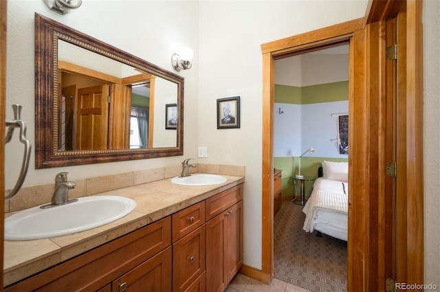 469 Elati St, Denver, CO 80204 - bathroom with a sink, tile patterned floors, and double vanity
