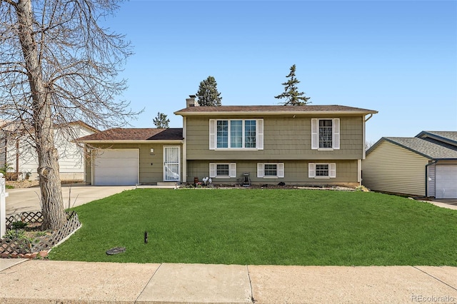 2034 S Idalia St, Aurora, CO 80013 - tri-level home featuring concrete driveway, a garage, a front yard, and a chimney
