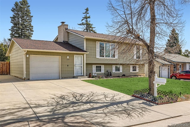2034 S Idalia St, Aurora, CO 80013 - split level home featuring a chimney, a garage, driveway, and roof with shingles