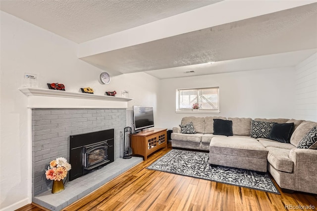 2034 S Idalia St, Aurora, CO 80013 - living area with a textured ceiling and hardwood / wood-style flooring