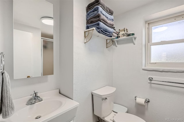 2034 S Idalia St, Aurora, CO 80013 - full bath featuring toilet, vanity, and a shower with door