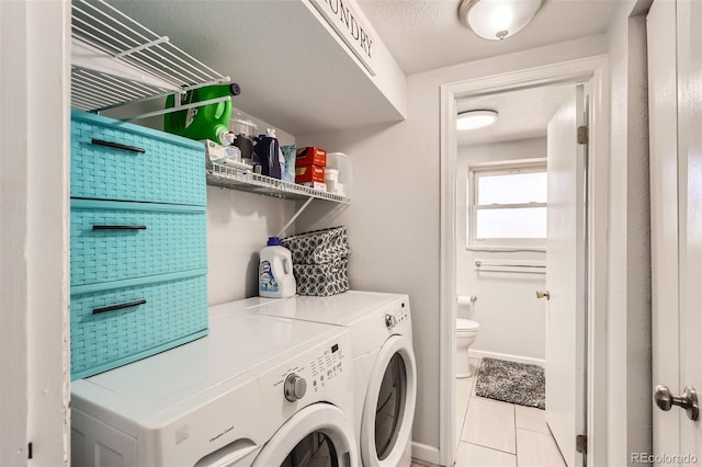 2034 S Idalia St, Aurora, CO 80013 - washroom featuring separate washer and dryer and tile patterned flooring