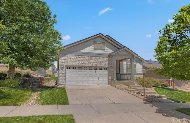 23421 E Long Pl, Aurora, CO 80016 - ranch-style home featuring concrete driveway, stone siding, an attached garage, and a front lawn