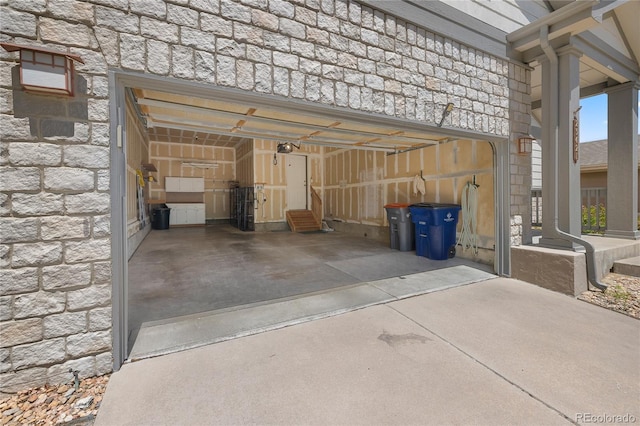 23421 E Long Pl, Aurora, CO 80016 - garage with driveway and a garage door opener