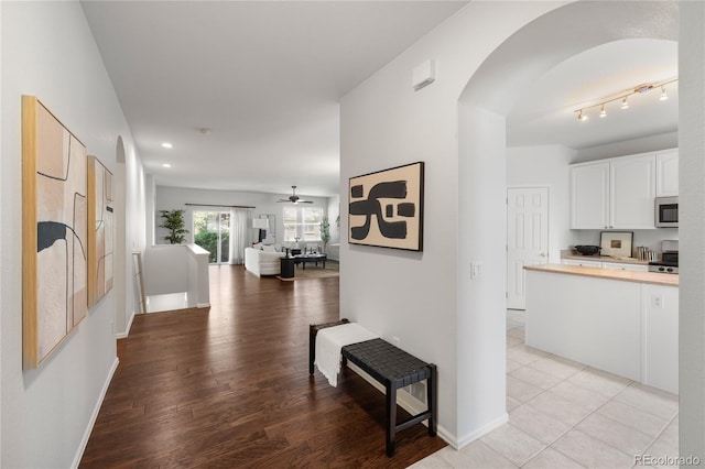 23421 E Long Pl, Aurora, CO 80016 - hall with arched walkways, light wood-style floors, and recessed lighting