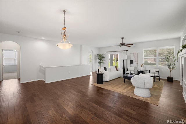 23421 E Long Pl, Aurora, CO 80016 - living room featuring arched walkways, a ceiling fan, wood finished floors, and recessed lighting