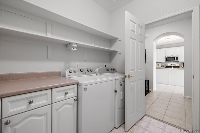 23421 E Long Pl, Aurora, CO 80016 - laundry area with washing machine and clothes dryer and arched walkways