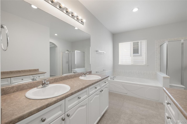 23421 E Long Pl, Aurora, CO 80016 - full bath with double vanity, a shower stall, a garden tub, and recessed lighting