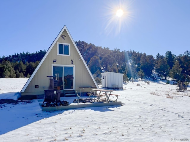 view of snow covered house