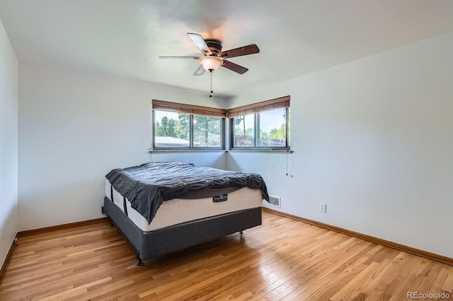 5600 Dover St, Arvada, CO 80002 - bedroom with baseboards, light wood finished floors, and ceiling fan