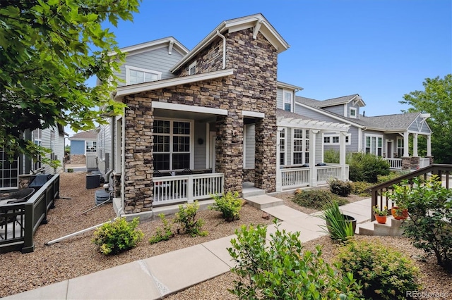 view of front of home featuring a pergola, central AC, and a porch