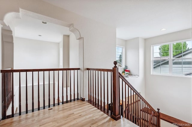 corridor with hardwood / wood-style floors