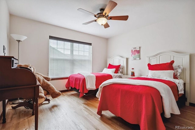 bedroom featuring ceiling fan and light hardwood / wood-style floors