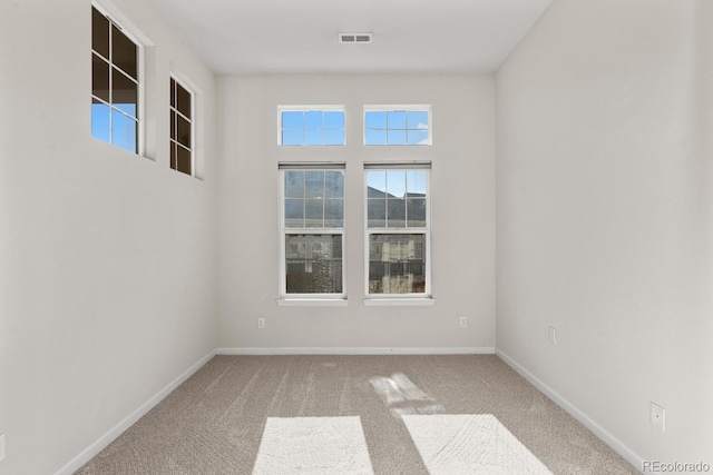 empty room with carpet flooring and baseboards