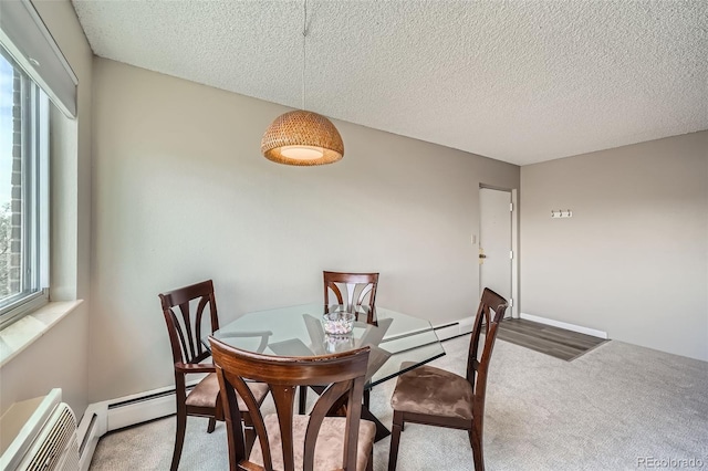 1045 N Pennsylvania St Unit 601, Denver, CO 80203 - dining space featuring carpet flooring, a textured ceiling, a baseboard heating unit, and baseboard heating