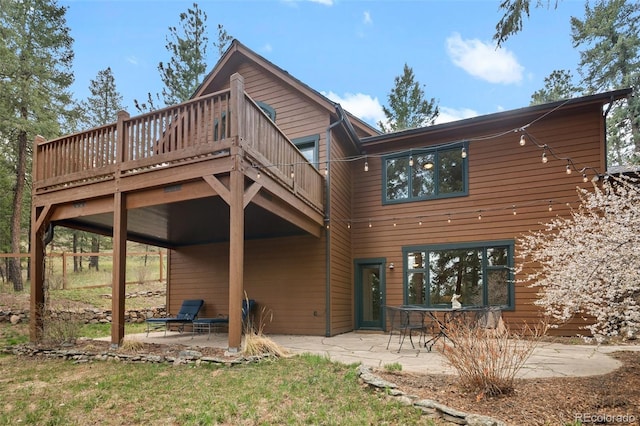 27711 Moffat Rd, Evergreen, CO 80439 - back of house featuring a patio and a deck