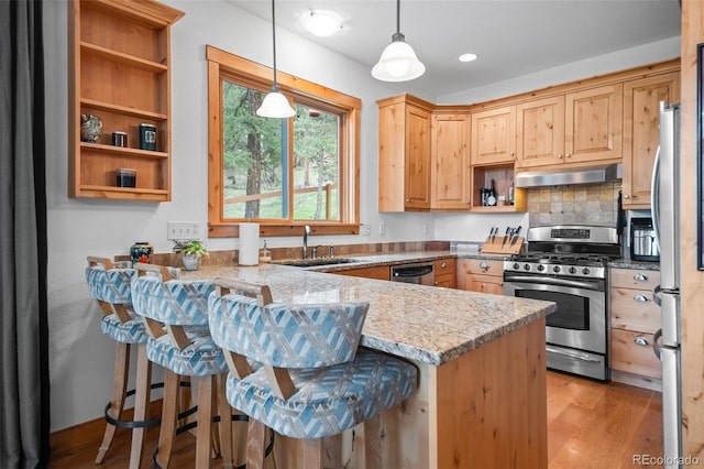 27711 Moffat Rd, Evergreen, CO 80439 - kitchen with appliances with stainless steel finishes, open shelves, a sink, a peninsula, and under cabinet range hood